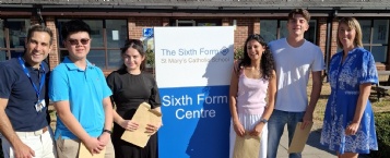 From left to right: Director of Sixth Form Mr Ben Noble, Fred Cheung, Lucia Pini, Marie Surujbally, Richard Luppi and Headteacher Miss Deirdre McHugh.